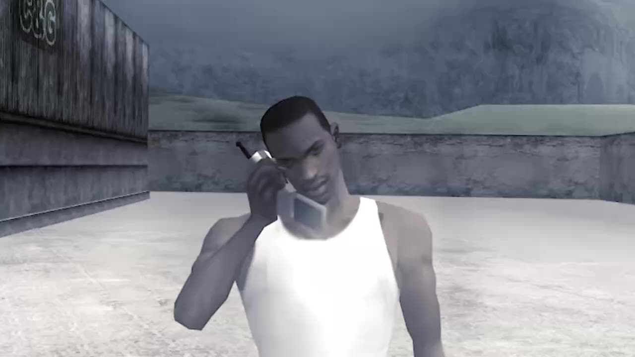 CJ on a flip phone in a dim concrete corridor